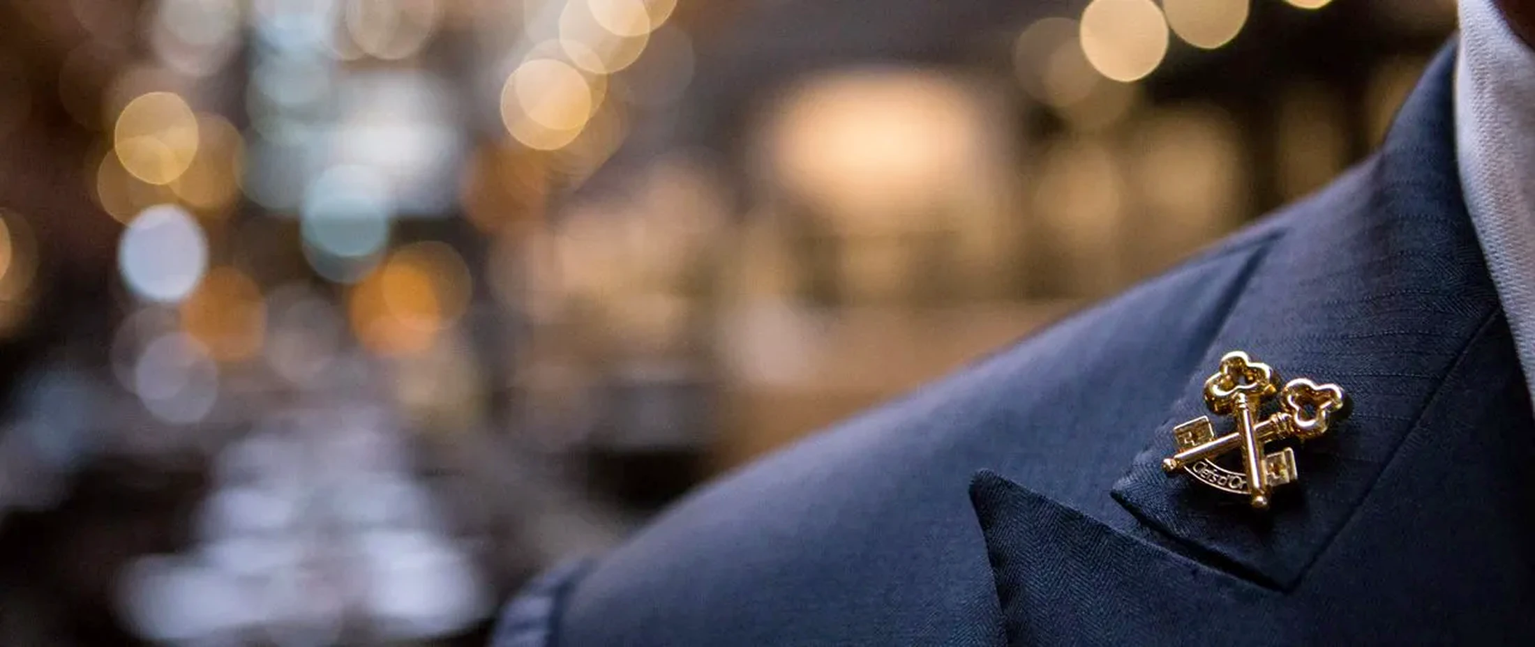 The Golden Keys insignia of Les Clefs d'Or on a concierge's lapel