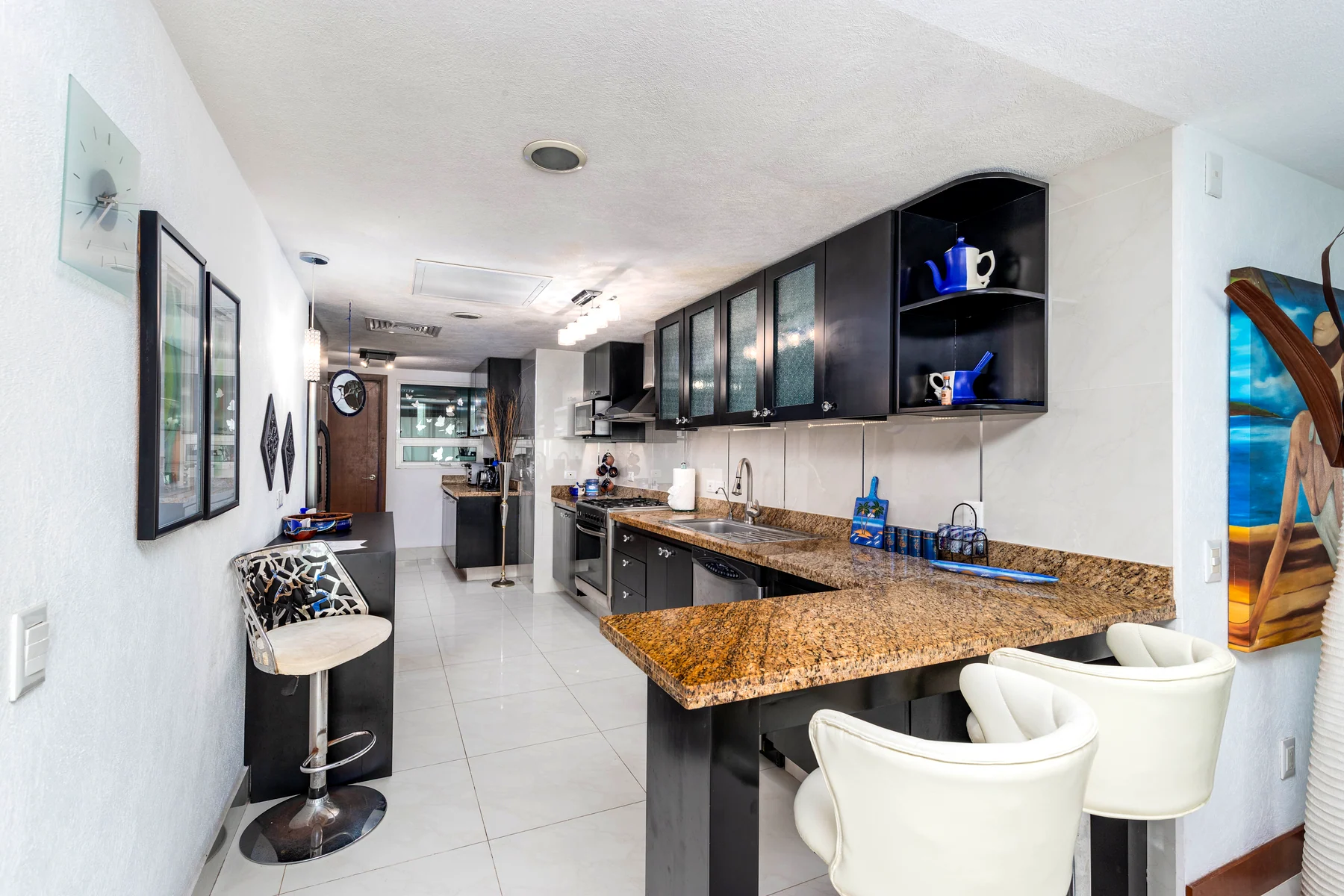 The granite kitchen bar, with stools