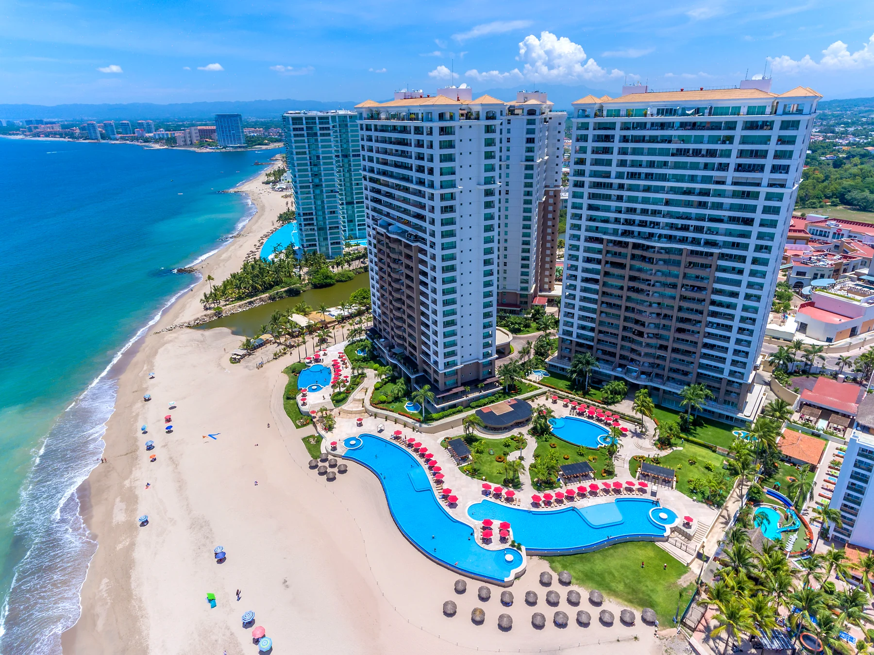 Aerial view of the Grand Venetian, its pools and the Puerto Vallarta beach