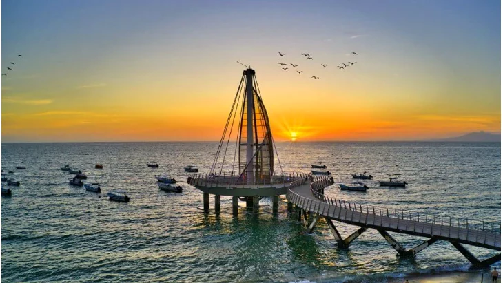 Sunset over Banderas Bay: the Los Muertos pier lit in gold