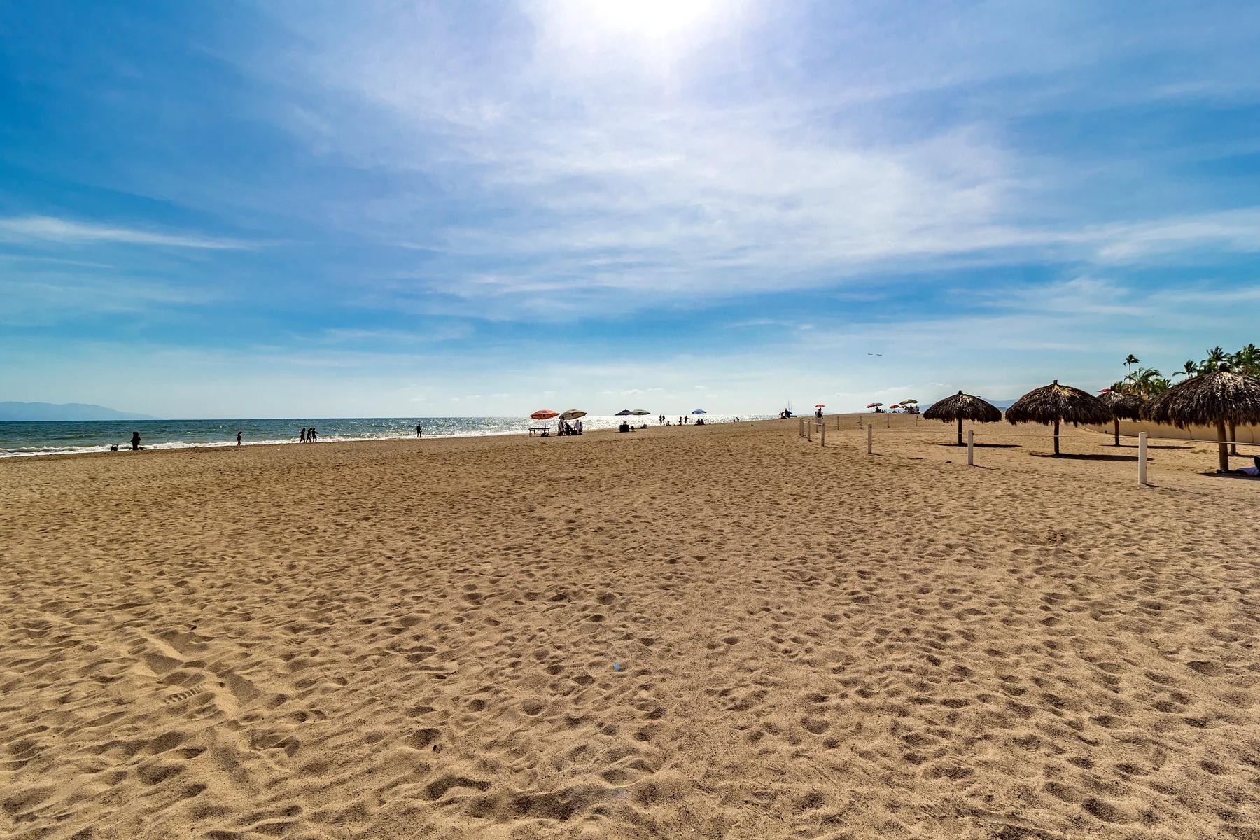 The open beach in front of the Grand Venetian, with palapas